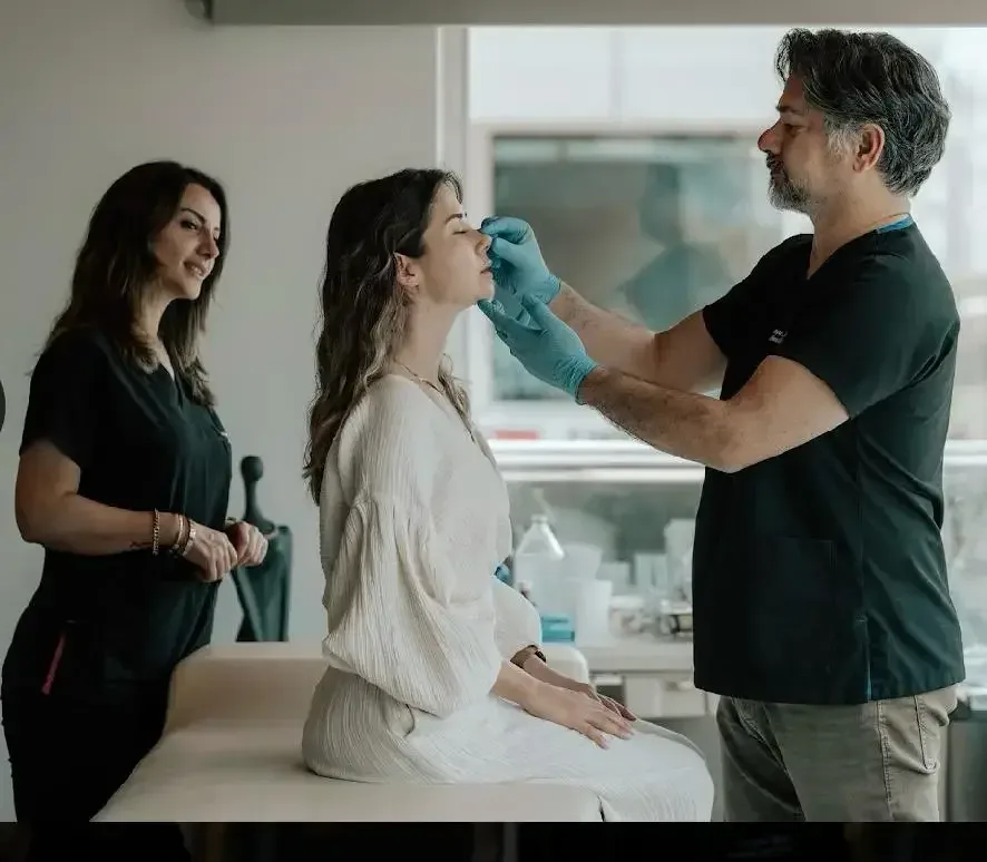 Dr. Oksar examining a patient at the clinic